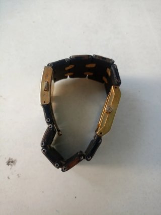 Reloj Nixon Negro y Dorado