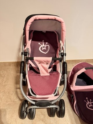 Cochecito de juguete rosa y morado