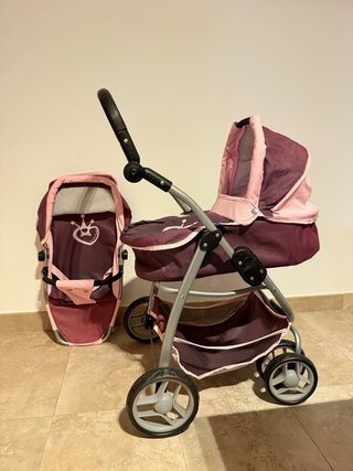 Cochecito de juguete rosa y morado