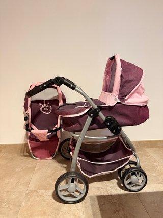 Cochecito de juguete rosa y morado