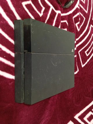 PS4 (PlayStation 4) con 2 mandos y 20 juegos