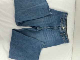 Pantalón vaquero ancho desgastado