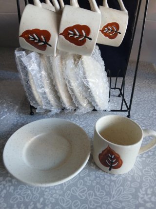 Juego de tazas de café con platillos