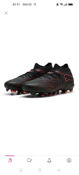Botas de fútbol Puma negras y naranjas