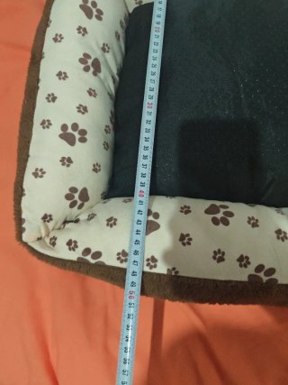 Cama para perro con etiqueta