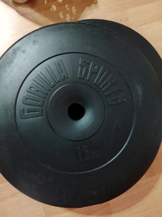 Barra de pesas con dos discos 15kg cada uno.