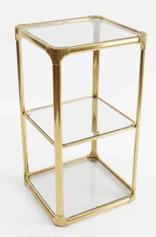 Mesa auxiliar metálica dorada con cristal