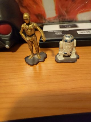 Lote 7 Piezas SW: Mochila, Tarjetero y Figuras