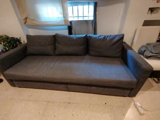 Sofá cama gris de tela