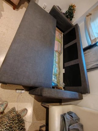 Sofá cama gris de tela