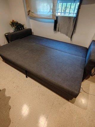 Sofá cama gris de tela