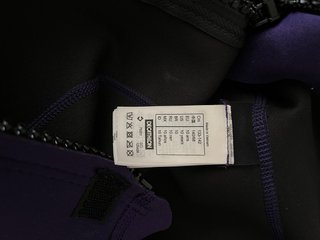 Neopreno corto Olaian morado y fucsia. Como nuevo