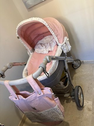 Carro de bebé rosa y gris
