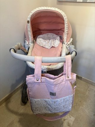 Carro de bebé rosa y gris