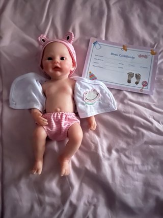 Muñeca de silicona bebé con traje