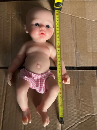 Muñeca de silicona bebé con traje