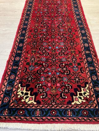 Alfombra persa de lana roja y azul