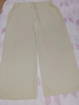 Pantalón de lino beige talla grande y pierna ancha