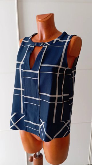 Blusa sin mangas azul y blanca. Chaleco. Talla 40.