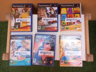 PlayStation 2 + 4 Micrófonos SingStar + juegos