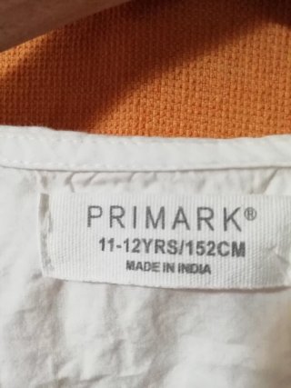 Camisa blanca Primark cuello volante