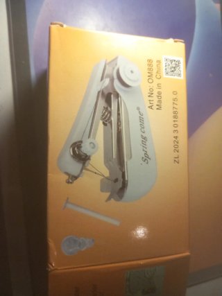 Máquina de coser portátil + hilos