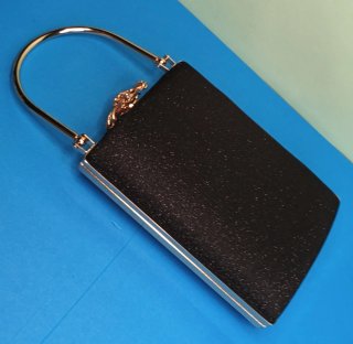 Bolso clutch negro asa metal  y cierre joya