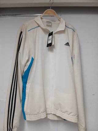 Chaqueta Adidas blanca con detalles azules