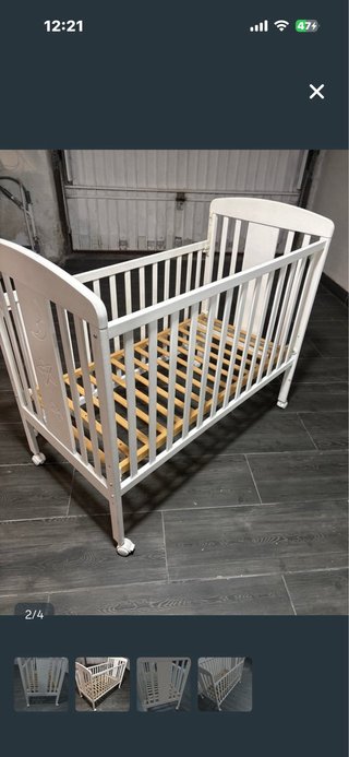 Cuna blanca con dibujos