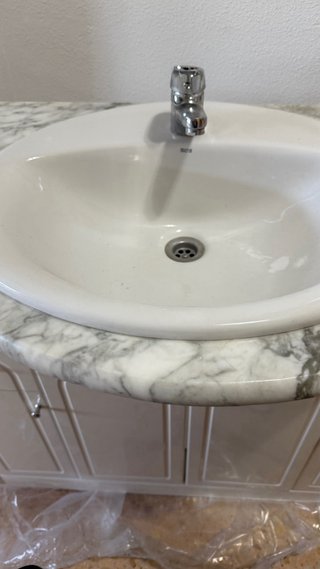 Mueble de baño con lavabo de mármol