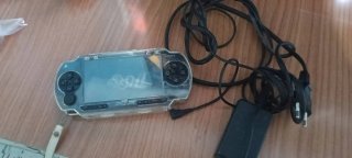 PSP Sony transparente con funda