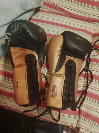 Guantes Boxeo Rival RS100 Profesional Oro/Negro