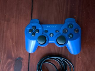 Playstation 3 Roja + Lote Juegos y dos mandos