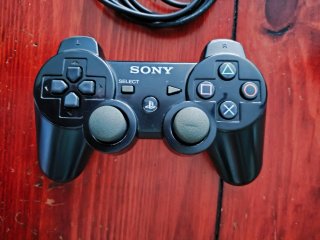 Playstation 3 Roja + Lote Juegos y dos mandos