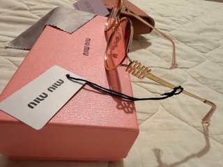 Gafas de sol Miu Miu doradas
