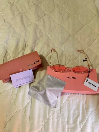 Gafas de sol Miu Miu doradas