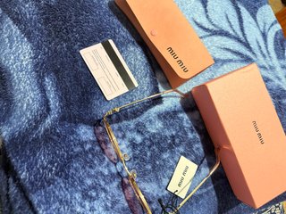 Gafas de sol Miu Miu doradas