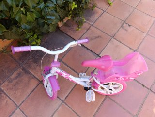Bicicleta infantil rosa y blanca