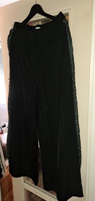 Pantalón Uterqüe anchos con detalles flecos