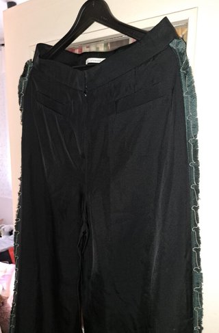 Pantalón Uterqüe anchos con detalles flecos