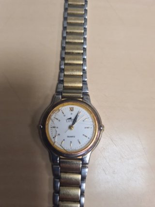 Reloj Lotus Oro y Plata