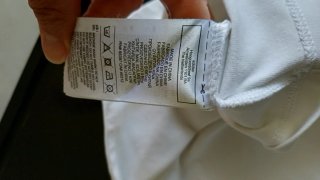 Top Adidas bianco con banda logo