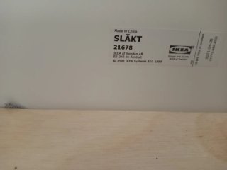 Cama extensible IKEA blanca, desmontada.
