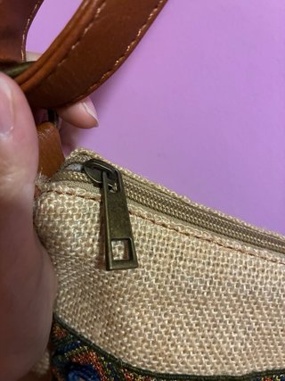 Bolso de tela con monedas y espejos