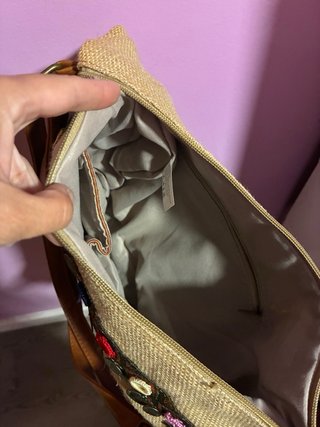 Bolso de tela con monedas y espejos