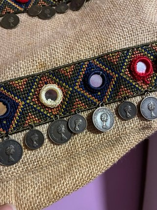 Bolso de tela con monedas y espejos