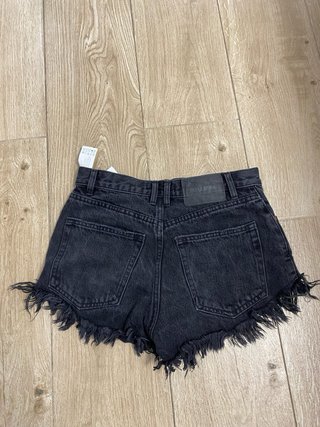 Pantalones cortos negros con flecos