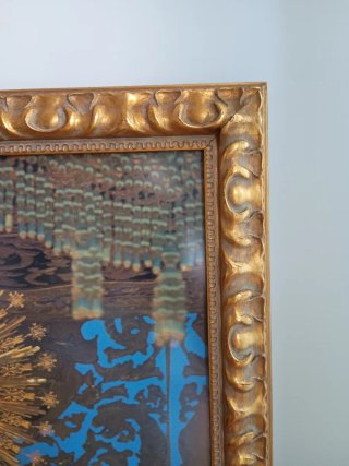 Marco de madera dorado tallado