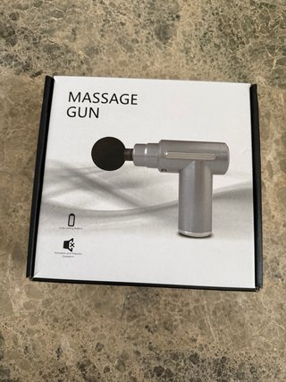 Pistola de masaje