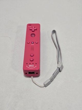 1 mando wii con Motion rosa original nintendo